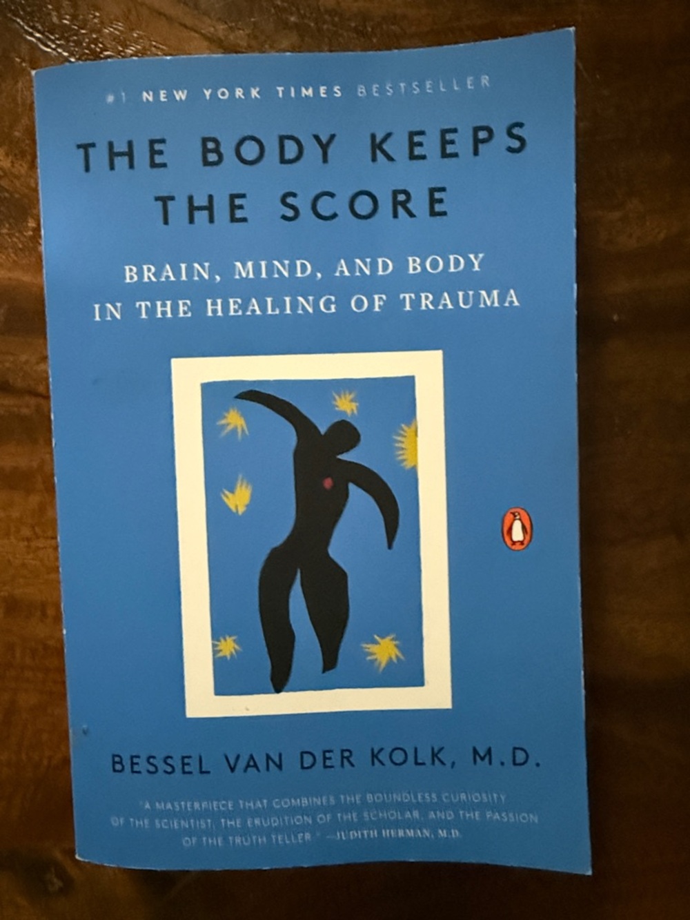 Original Penguin blue book cover with black figure and yellow accents